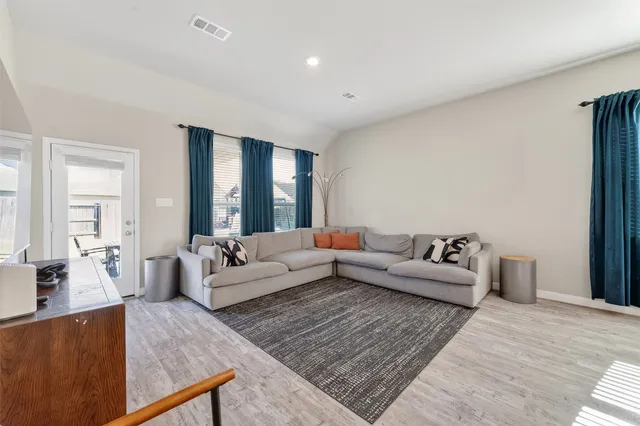 a living room with furniture and a couch