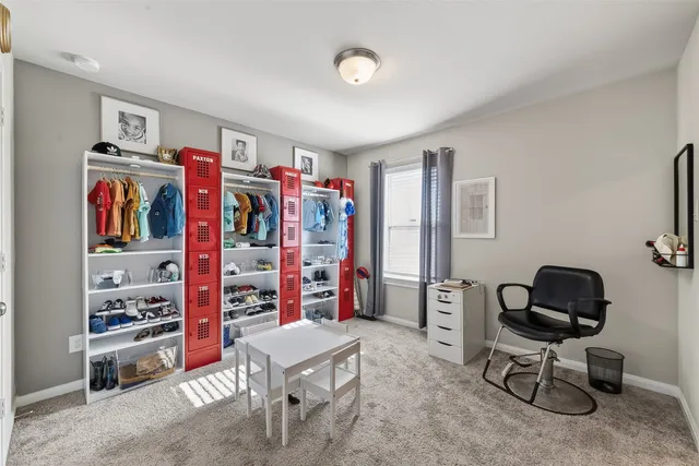 a view of a workspace with furniture