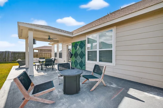 a view of a house with swimming pool and a chairs