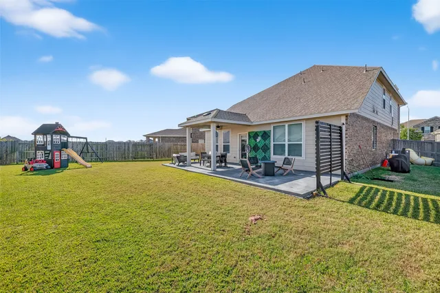 a view of a house with swimming pool and porch