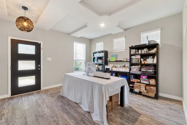 a view of a kitchen center island and wooden floor