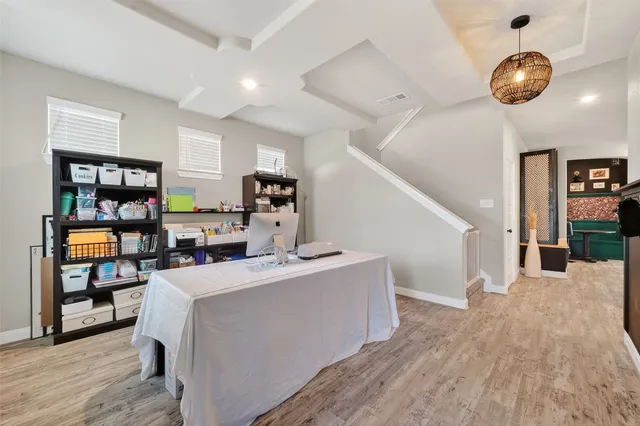 a living room with fireplace furniture and a book shelf