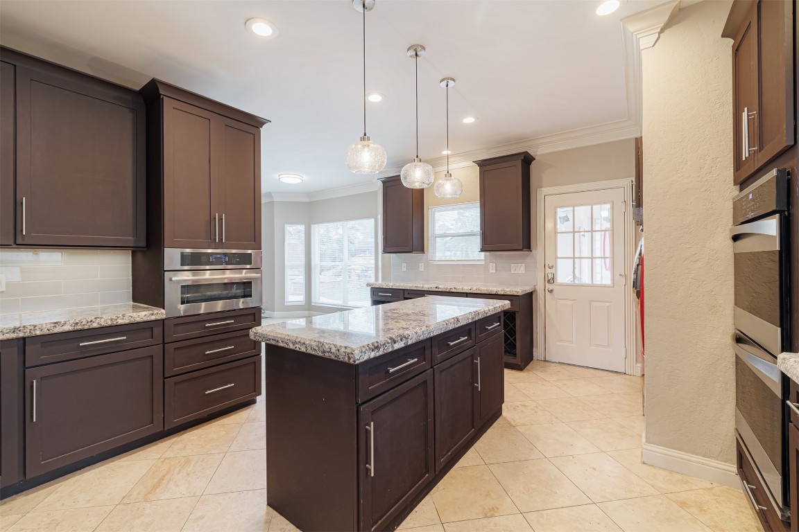 20615 Gable Ridge Drive Katy, TX 77450 - Photo 13 of 42 a kitchen with stainless steel appliances granite countertop a sink a stove and a refrigerator