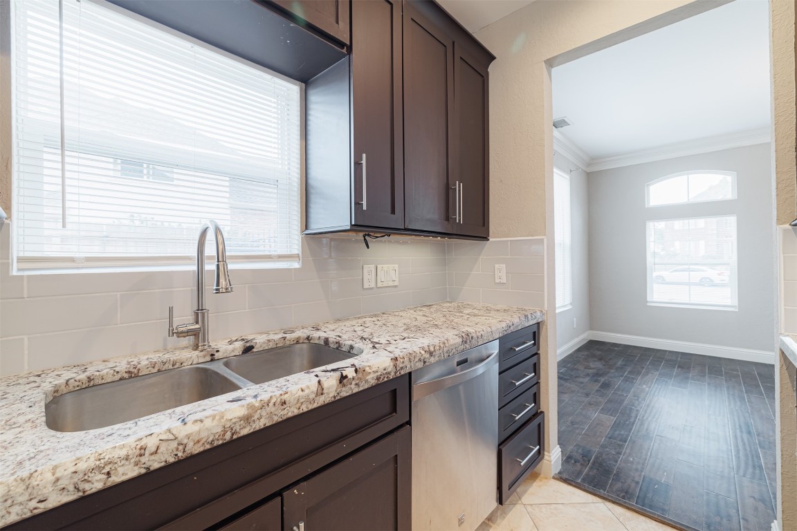 20615 Gable Ridge Drive Katy, TX 77450 - Photo 14 of 42 a kitchen with granite countertop a sink and a window