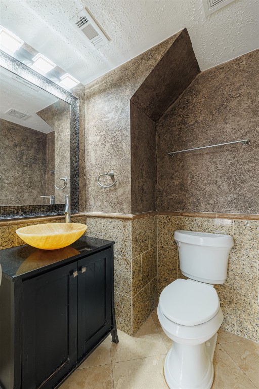 20615 Gable Ridge Drive Katy, TX 77450 - Photo 20 of 42 a bathroom with a granite countertop toilet sink and mirror