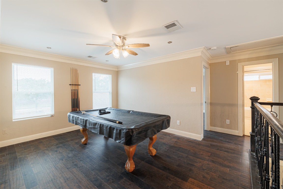 20615 Gable Ridge Drive Katy, TX 77450 - Photo 21 of 42 a room with wooden floor a ceiling fan and a window