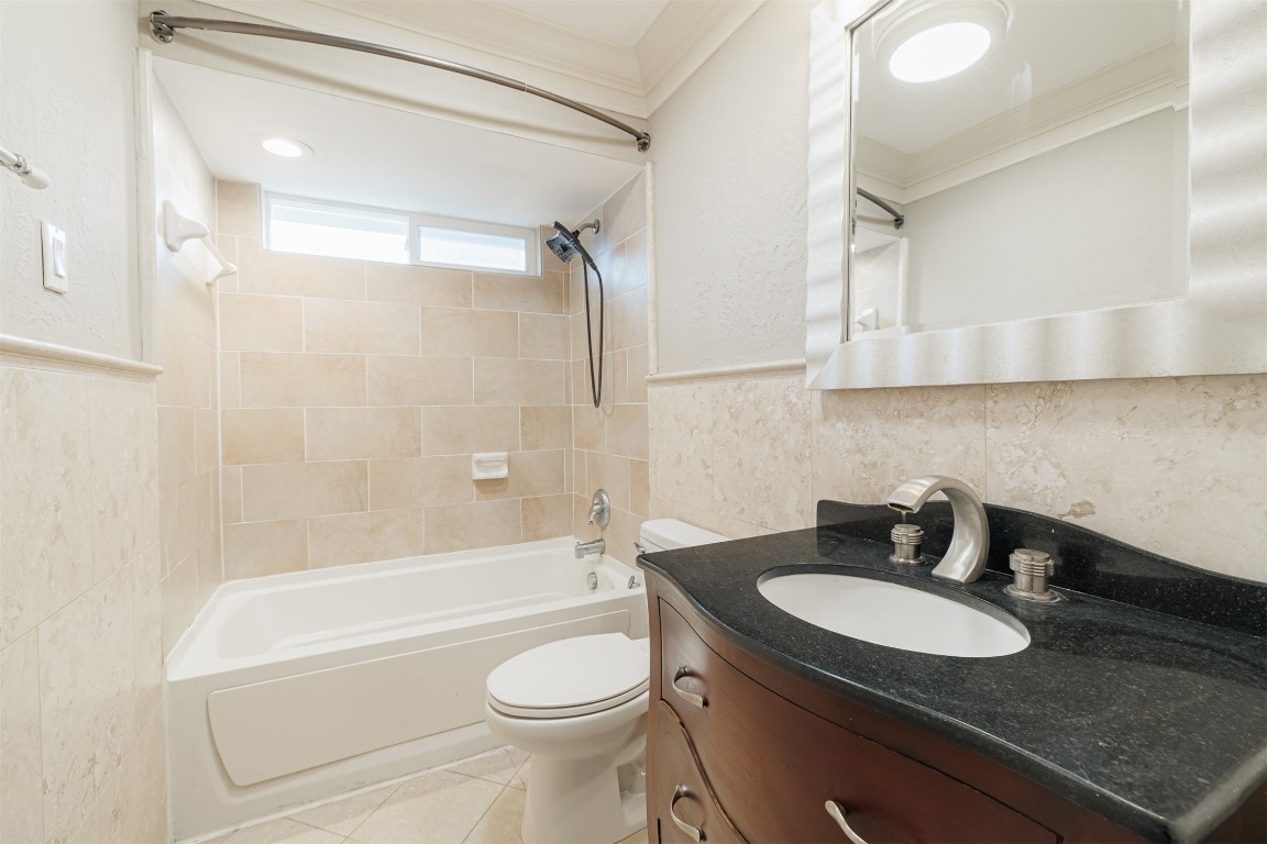 20615 Gable Ridge Drive Katy, TX 77450 - Photo 29 of 42 a bathroom with a granite countertop sink toilet and shower