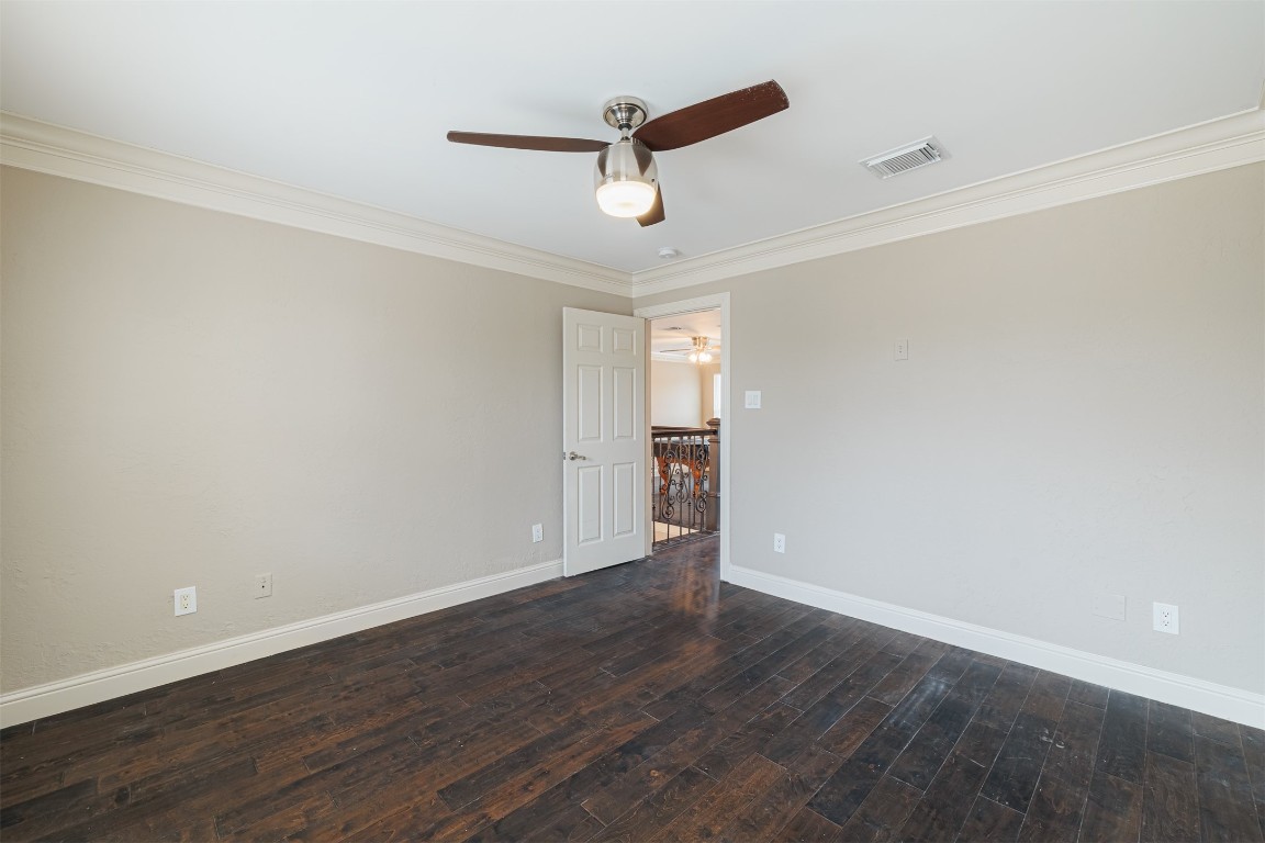 20615 Gable Ridge Drive Katy, TX 77450 - Photo 36 of 42 an empty room with wooden floor ceiling fan and windows