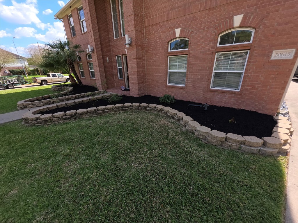 20615 Gable Ridge Drive Katy, TX 77450 - Photo 4 of 42 a front view of a house with a garden