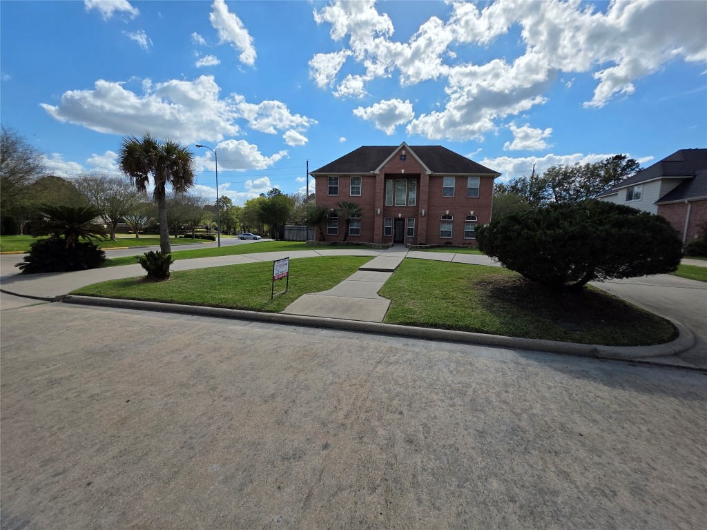 20615 Gable Ridge Drive Katy, TX 77450 - Photo 5 of 42 a front view of a house with garden
