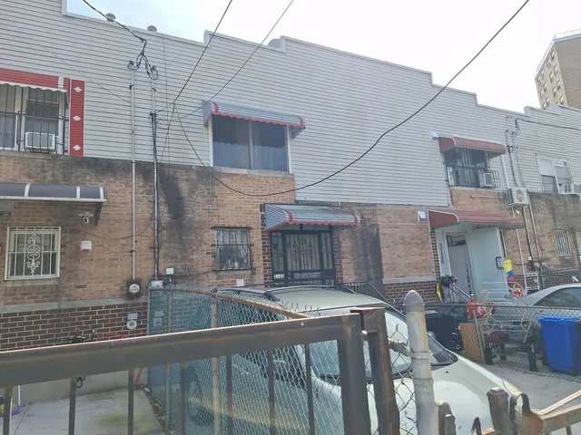 a city street lined with buildings and cars