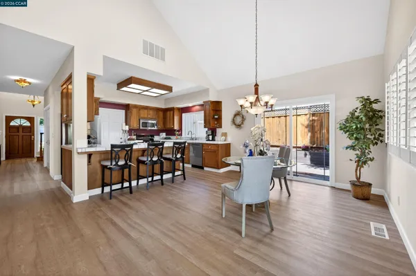 a view of a dining room with furniture window and wooden floor