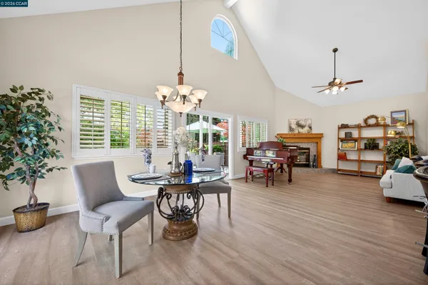 a bedroom with a bed lamp and window