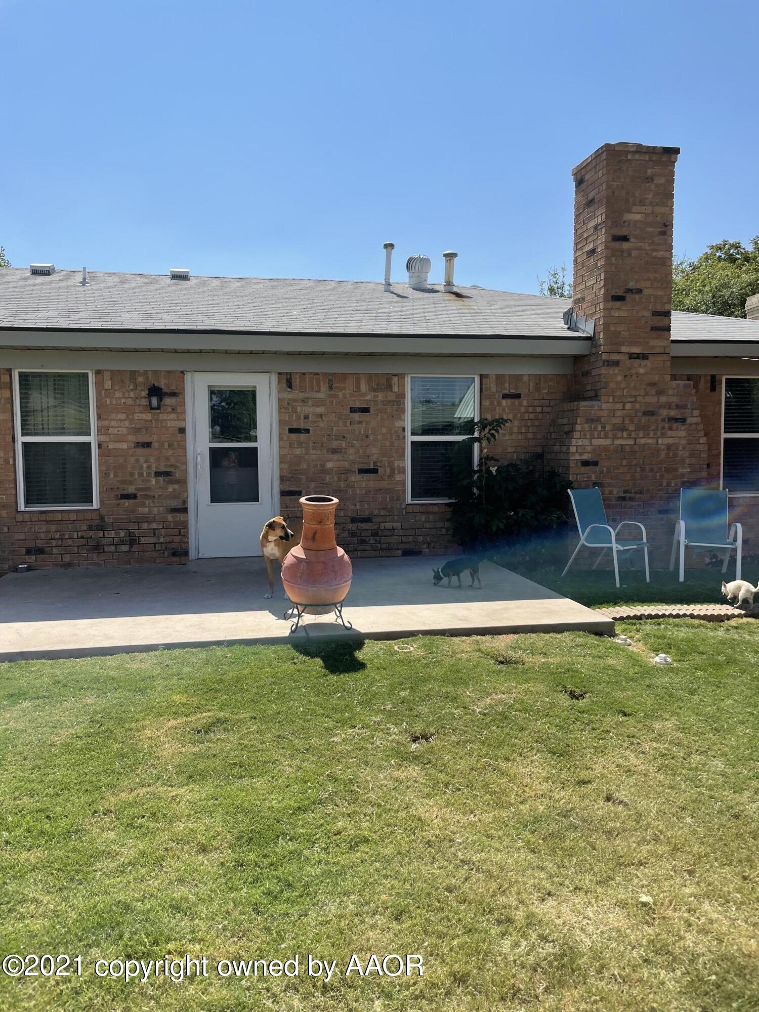 6101 Shawnee Trail Amarillo, TX 79109 - Photo 18 of 20 a view of a house with a yard and furniture