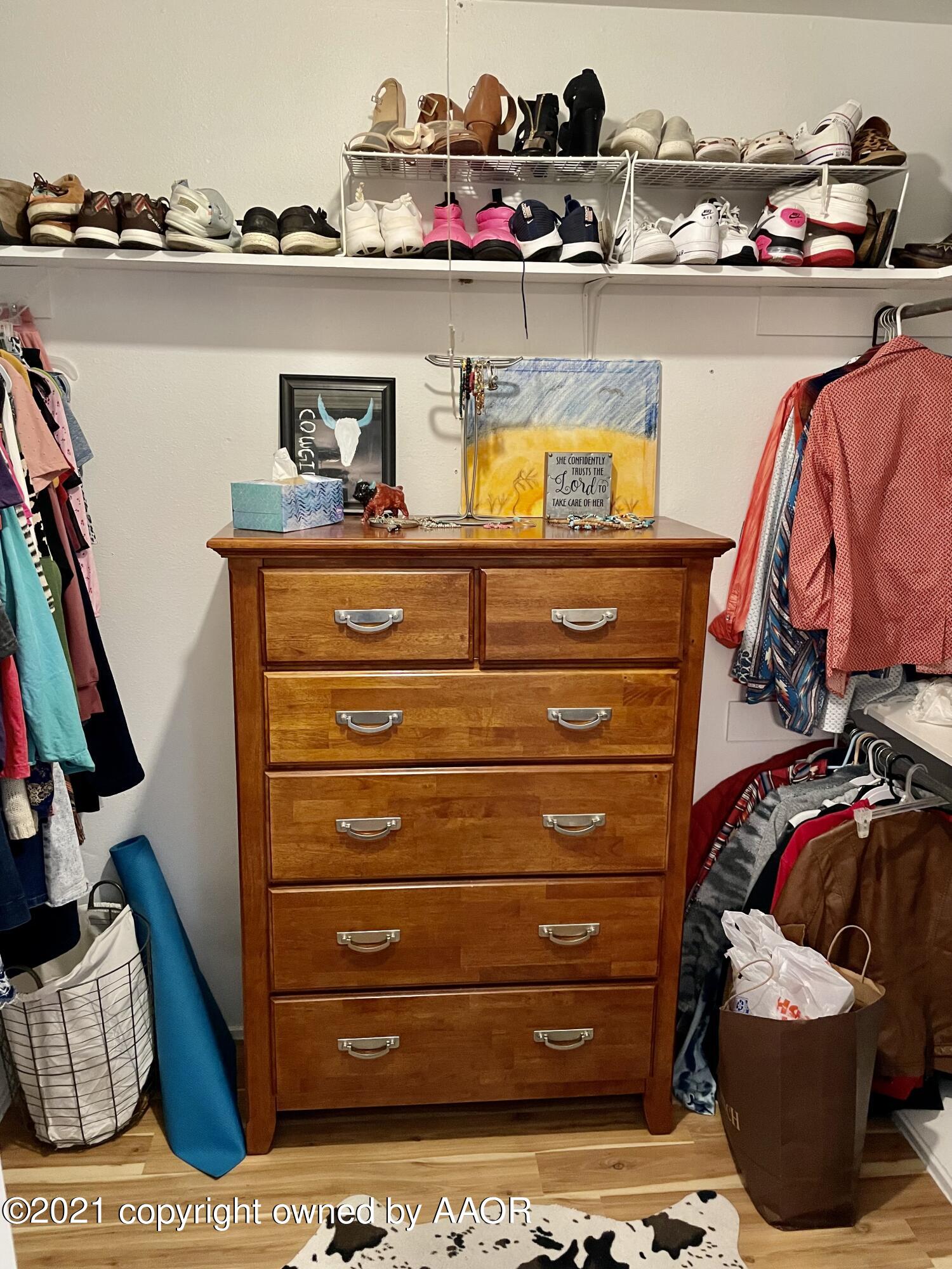 6101 Shawnee Trail Amarillo, TX 79109 - Photo 10 of 20 a view of walk in closet with clothes and shoes