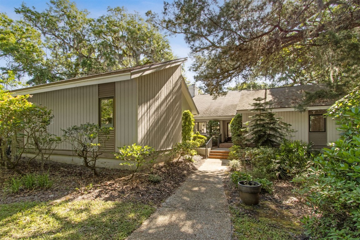 75 Marsh Creek Road Fernandina Beach, FL 32034 - Photo 1 of 42 a backyard of a house with outdoor seating
