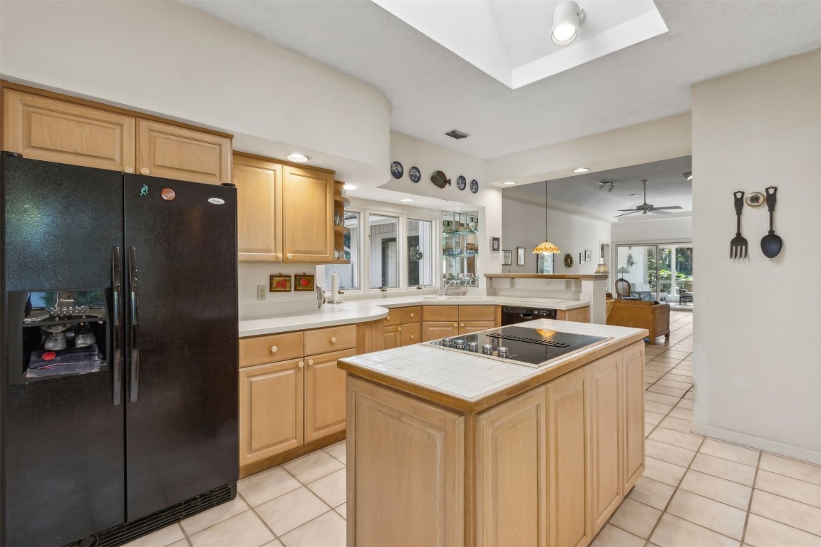 75 Marsh Creek Road Fernandina Beach, FL 32034 - Photo 12 of 42 a kitchen with stainless steel appliances granite countertop a sink stove and refrigerator