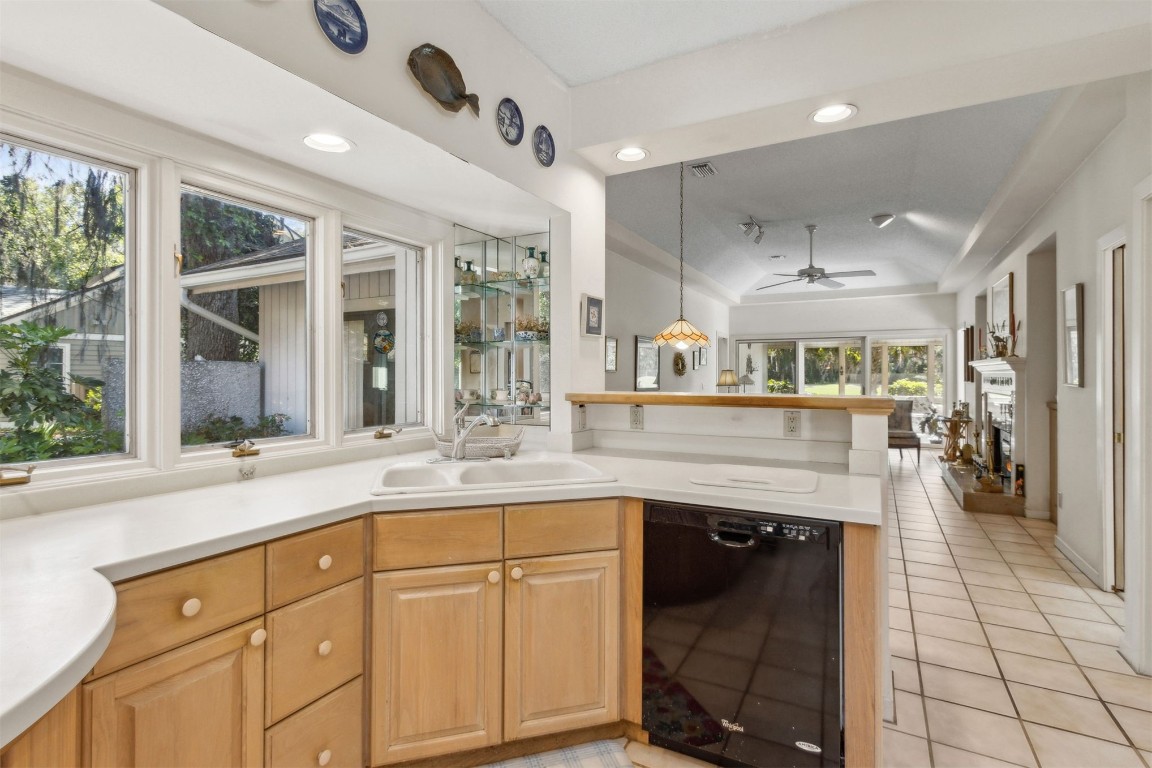 75 Marsh Creek Road Fernandina Beach, FL 32034 - Photo 13 of 42 a kitchen with granite countertop a sink stainless steel appliances and cabinets