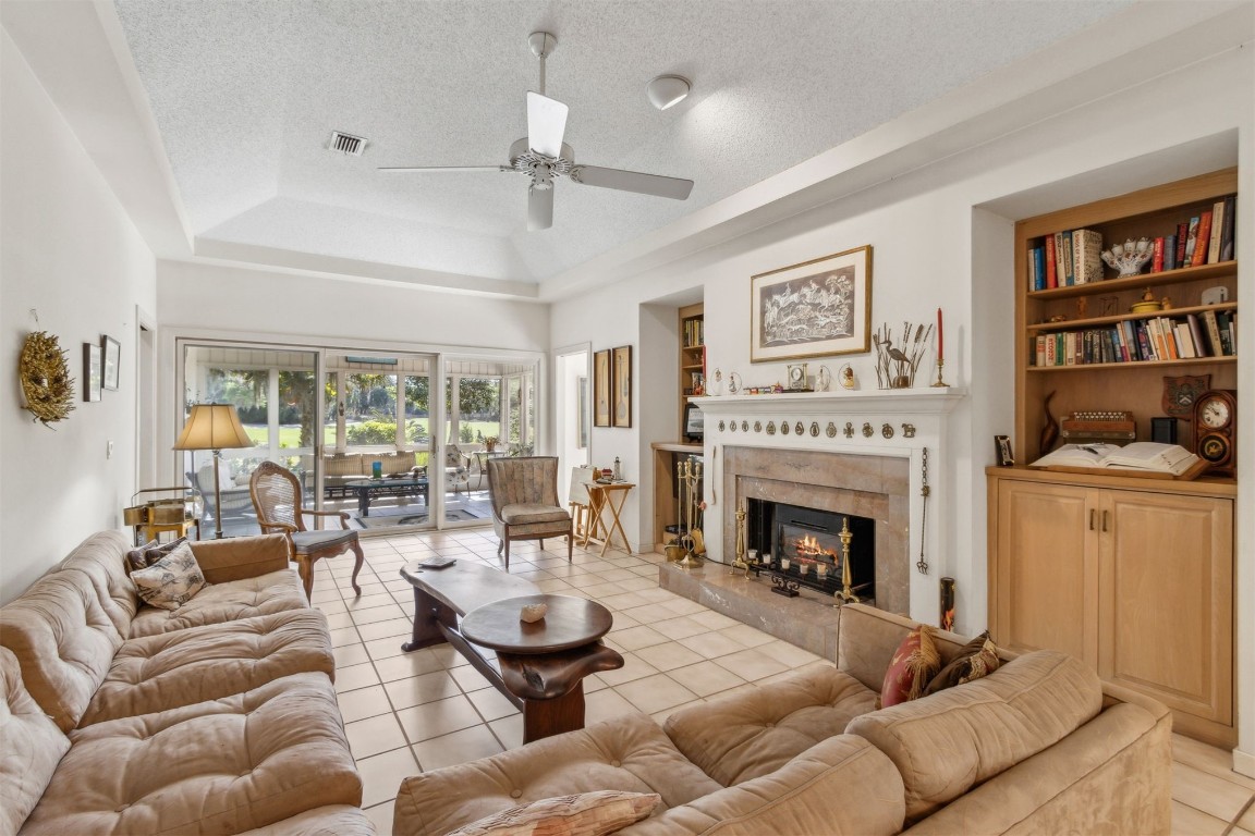 75 Marsh Creek Road Fernandina Beach, FL 32034 - Photo 17 of 42 a living room with furniture and a fireplace