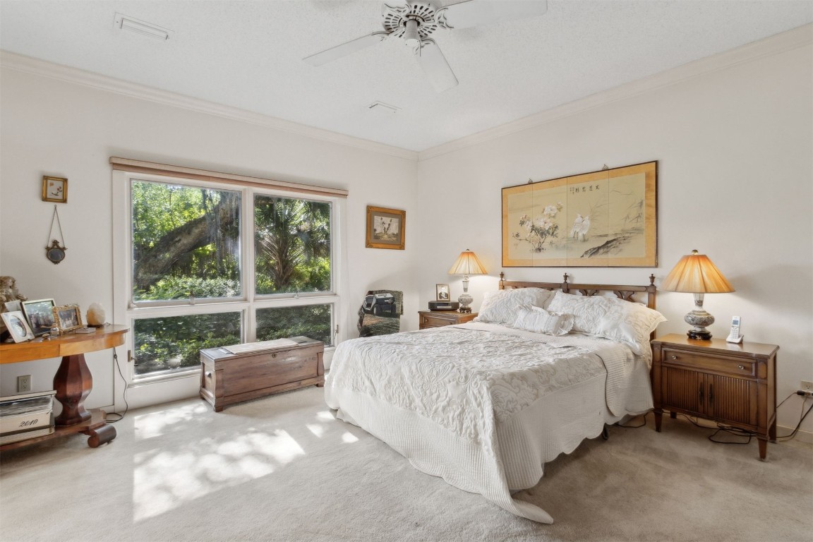 75 Marsh Creek Road Fernandina Beach, FL 32034 - Photo 21 of 42 a bedroom with a bed and a window