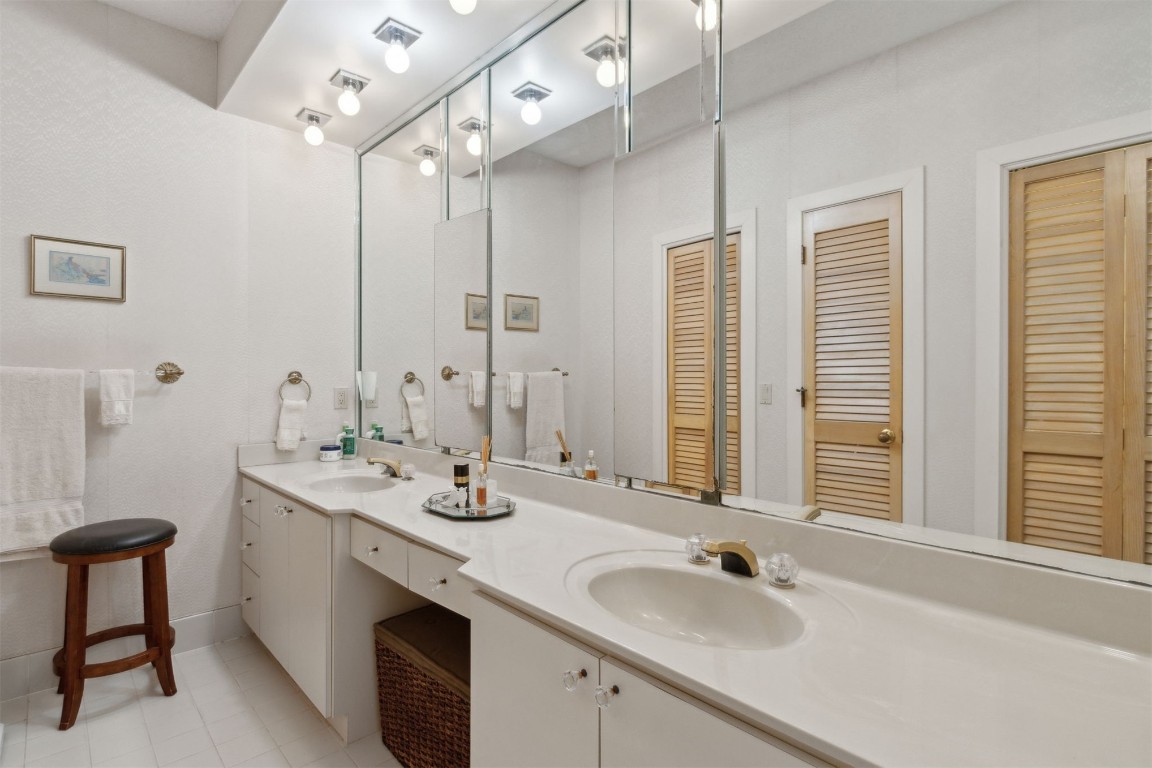 75 Marsh Creek Road Fernandina Beach, FL 32034 - Photo 23 of 42 a bathroom with double vanity sinks and a mirror