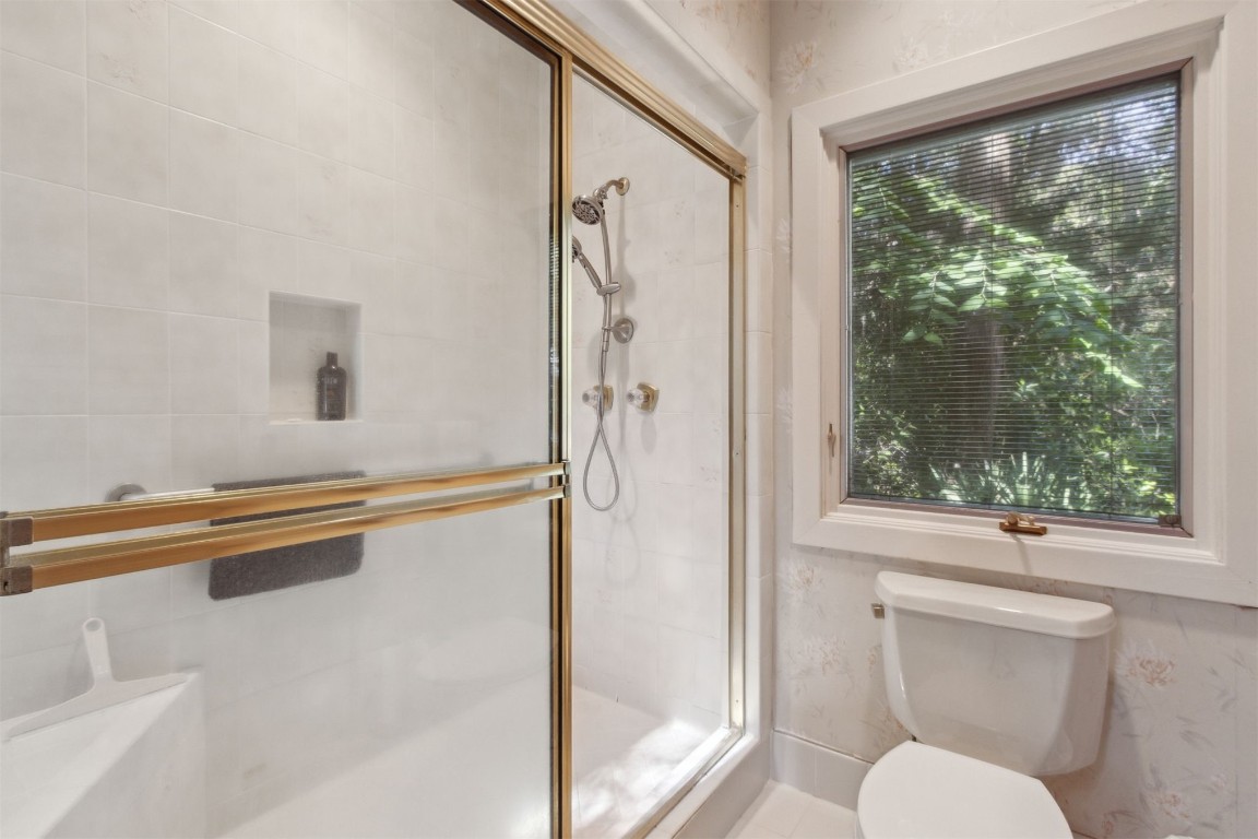 75 Marsh Creek Road Fernandina Beach, FL 32034 - Photo 25 of 42 a bathroom with a bathtub and a shower