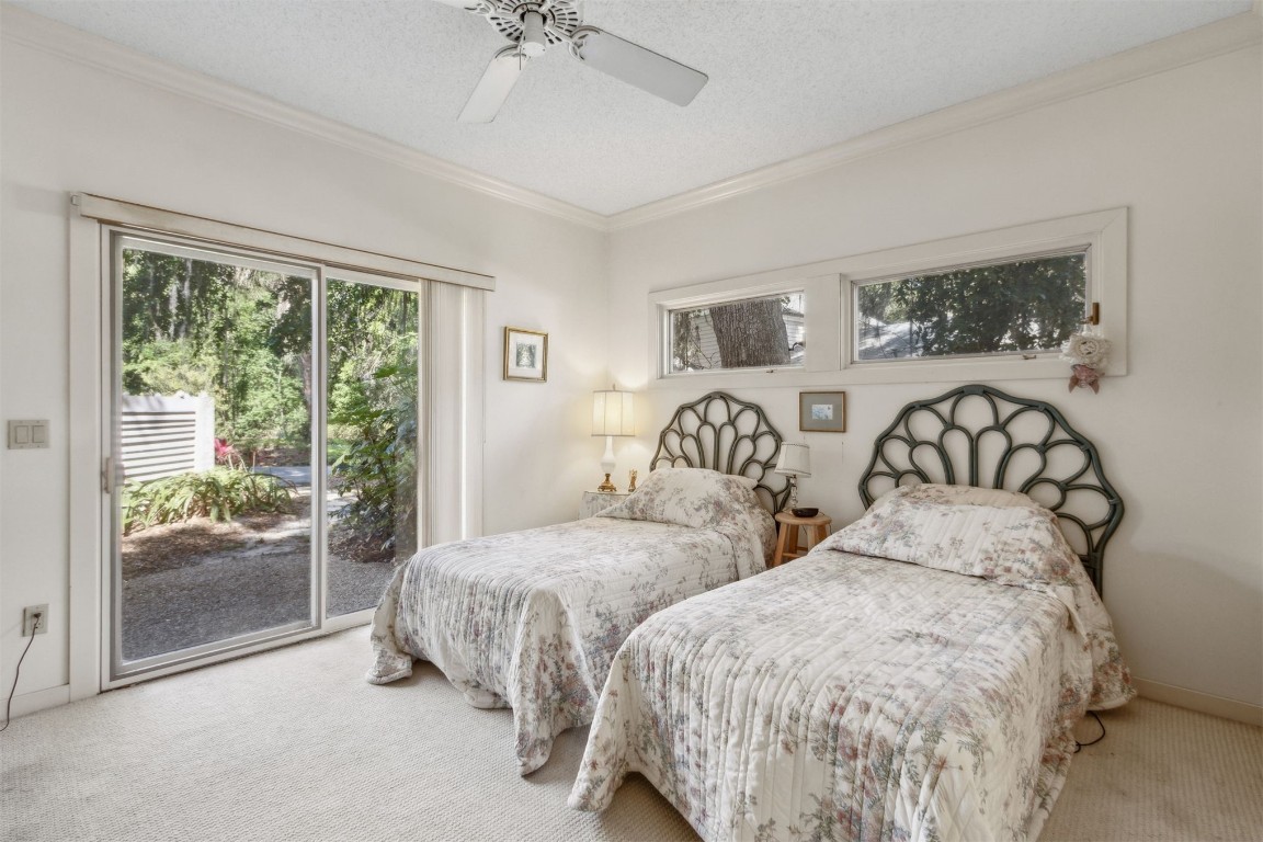 75 Marsh Creek Road Fernandina Beach, FL 32034 - Photo 28 of 42 a bedroom with two beds and next to a window