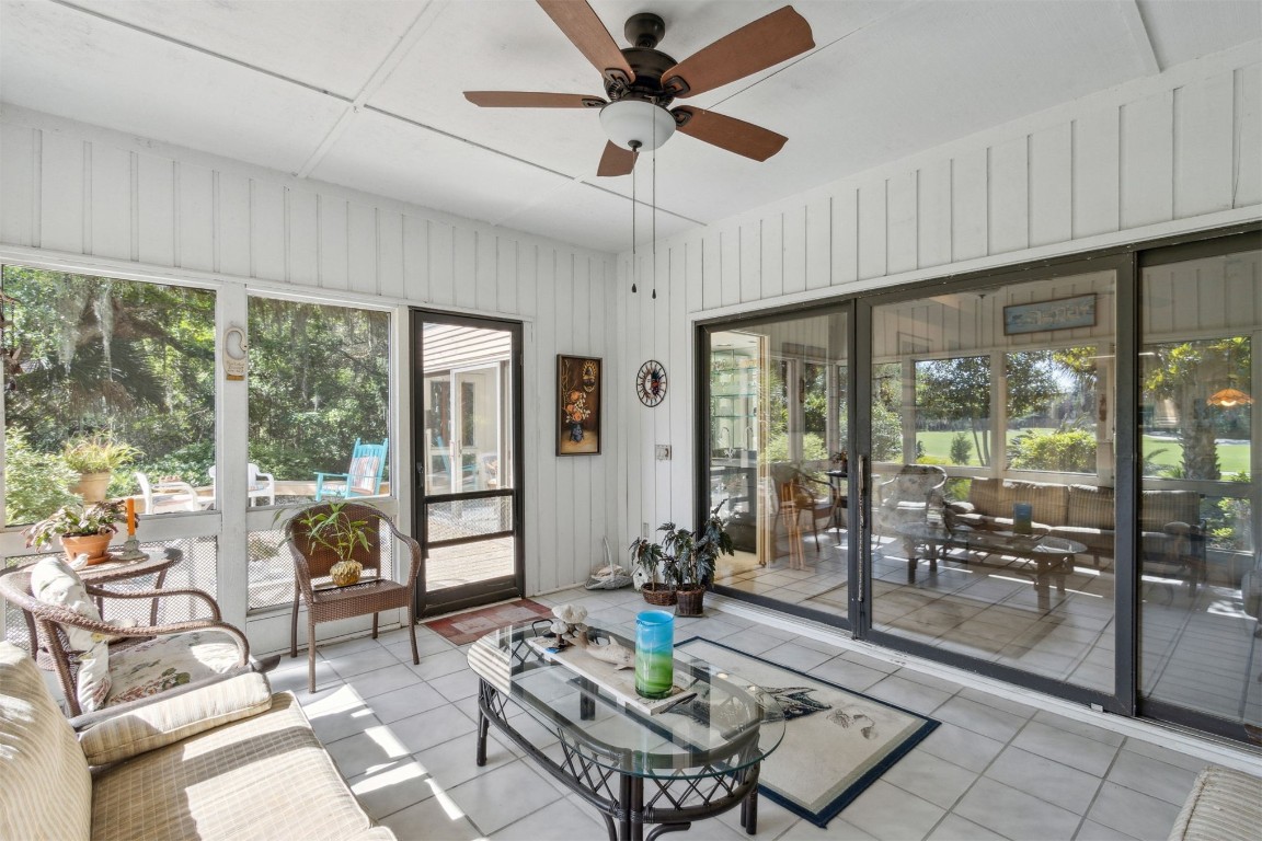 75 Marsh Creek Road Fernandina Beach, FL 32034 - Photo 29 of 42 a living room with furniture and large windows