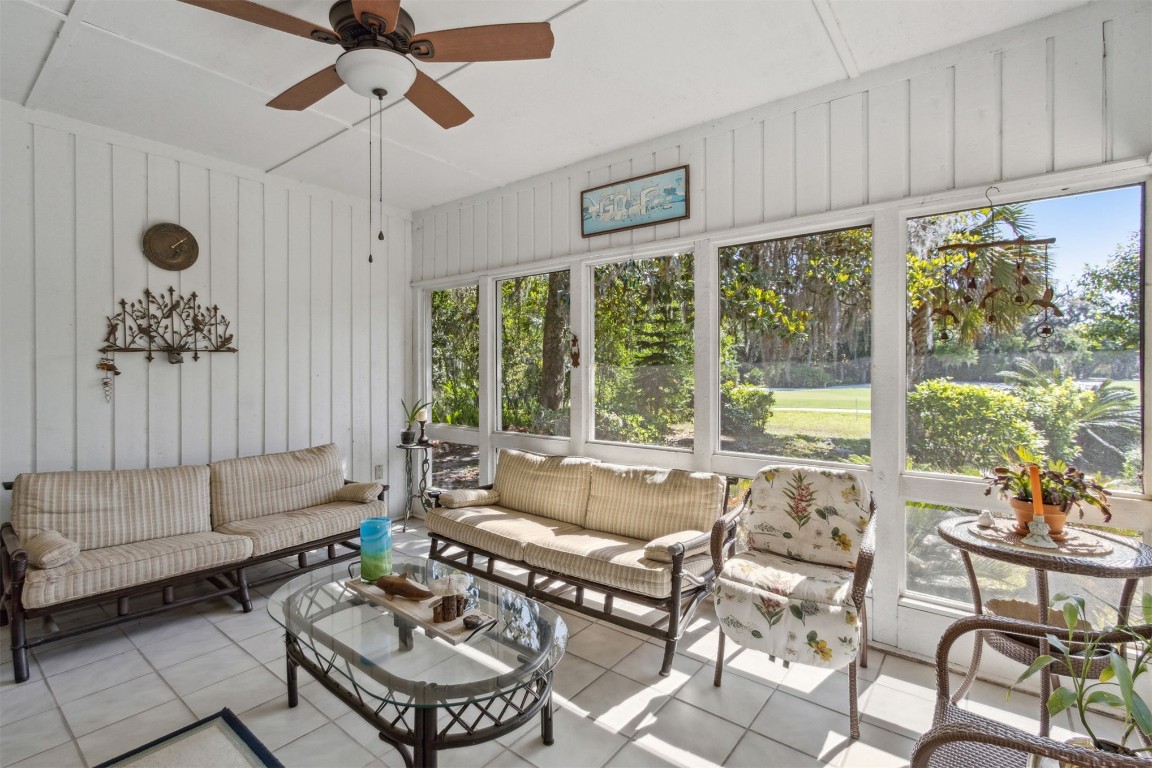 75 Marsh Creek Road Fernandina Beach, FL 32034 - Photo 30 of 42 a living room with furniture and a large window