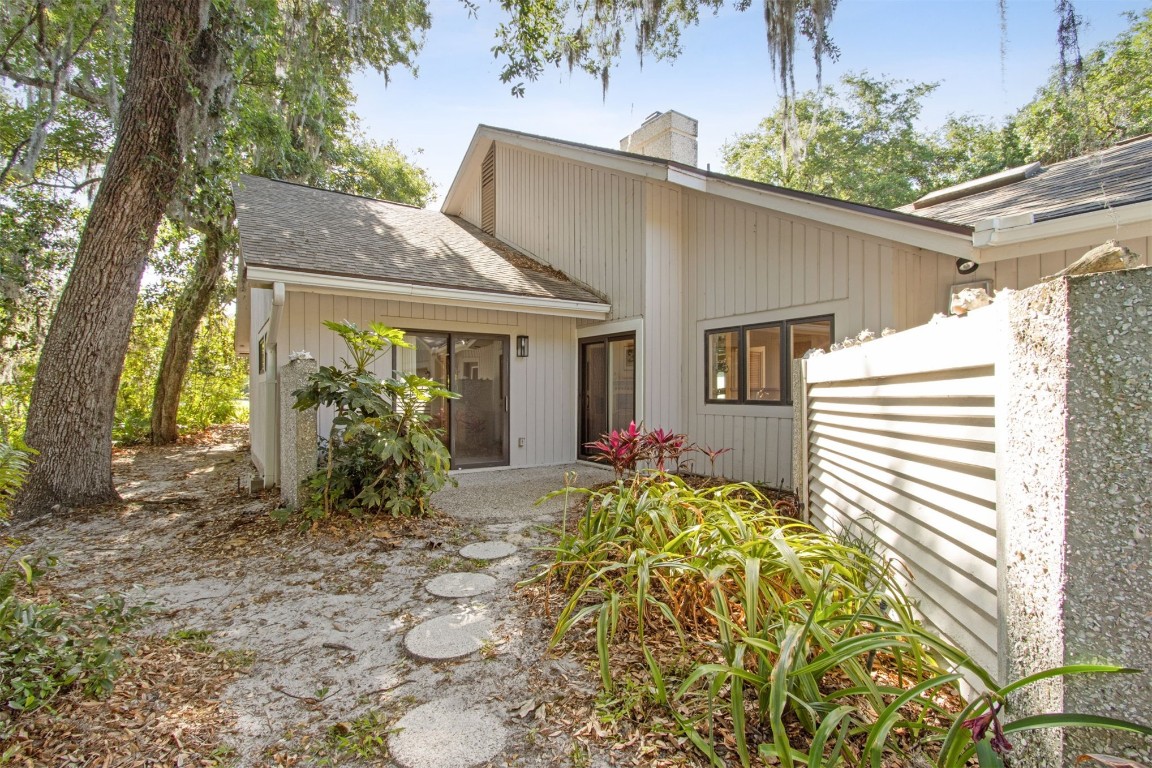 75 Marsh Creek Road Fernandina Beach, FL 32034 - Photo 32 of 42 a front view of a house with garden