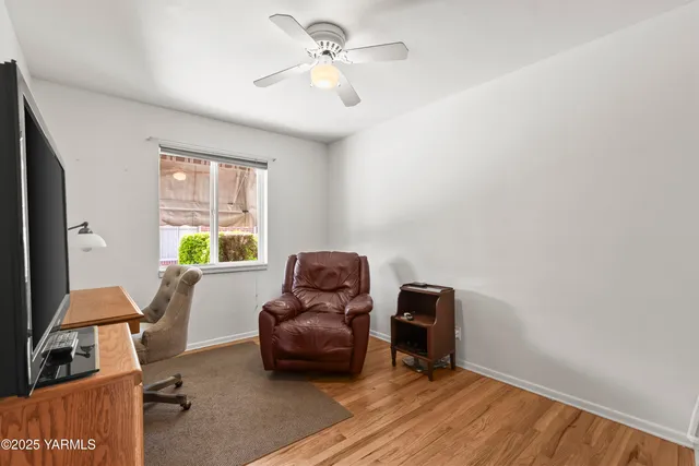 a living room with furniture and a window