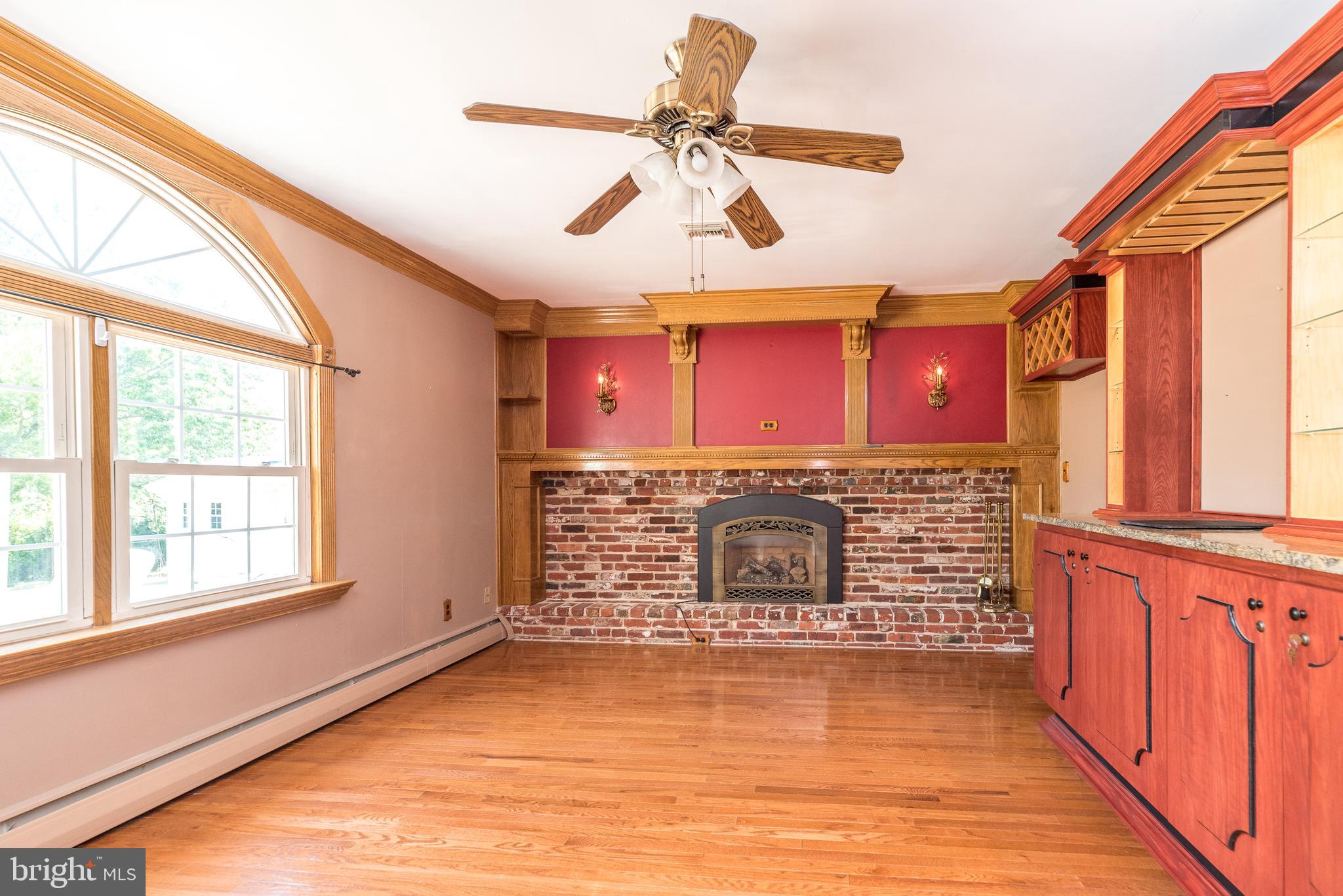 310 Farm Circle Eagleville, PA 19403 - Photo 31 of 75 Family room with a gas fireplace