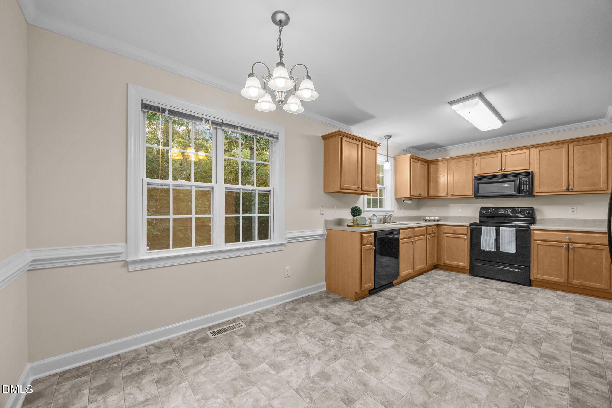 505 Vinson Road Clayton, NC 27527 - Photo 11 of 31 a kitchen with stainless steel appliances granite countertop a stove sink and microwave