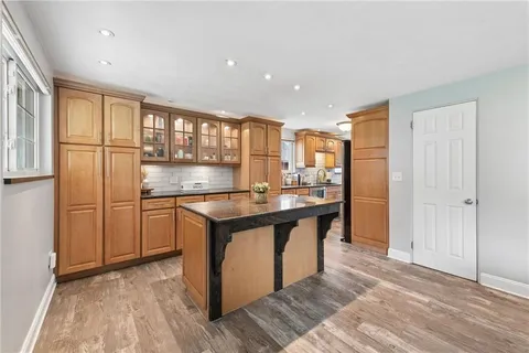 a kitchen with stainless steel appliances granite countertop a stove and a refrigerator