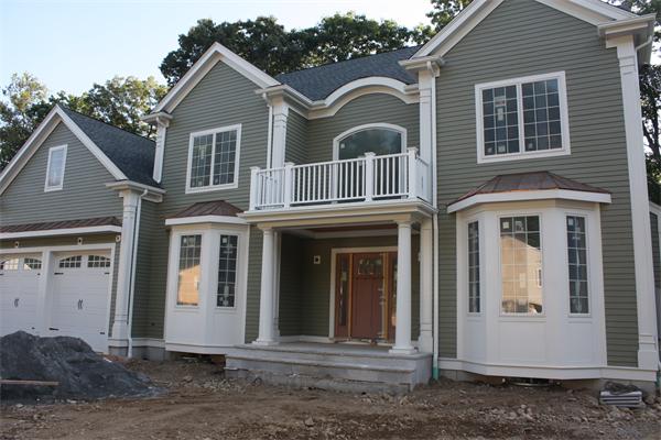 67 Wayne Road Needham, MA 02494 - Photo 1 of 1 a front view of a house with a yard