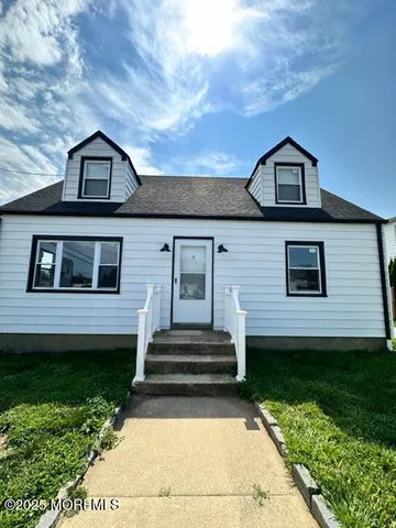 a view of house with yard