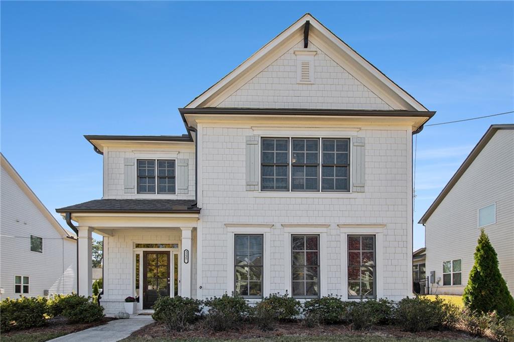 a front view of a house with garden