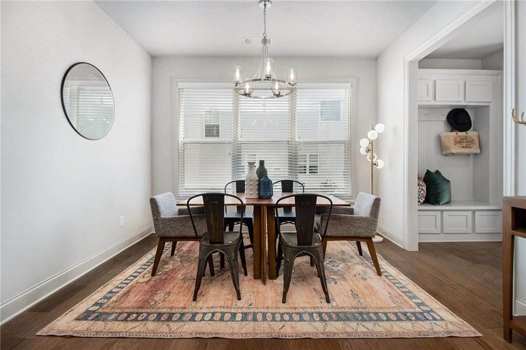 3235 Rockbridge Road Southwest Avondale Estates, GA 30002 - Photo 13 of 37 a view of a dining room with furniture and wooden floor