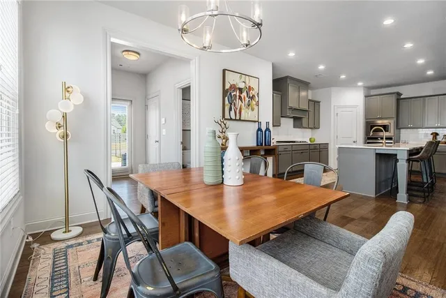 a view of a dining room with furniture and wooden floor