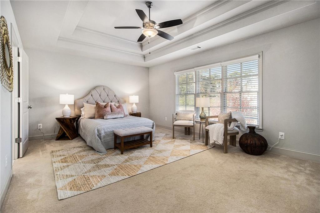 3235 Rockbridge Road Southwest Avondale Estates, GA 30002 - Photo 19 of 37 a bedroom with furniture and large windows