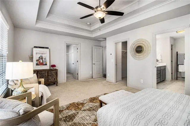 a bedroom with furniture and a wooden floor
