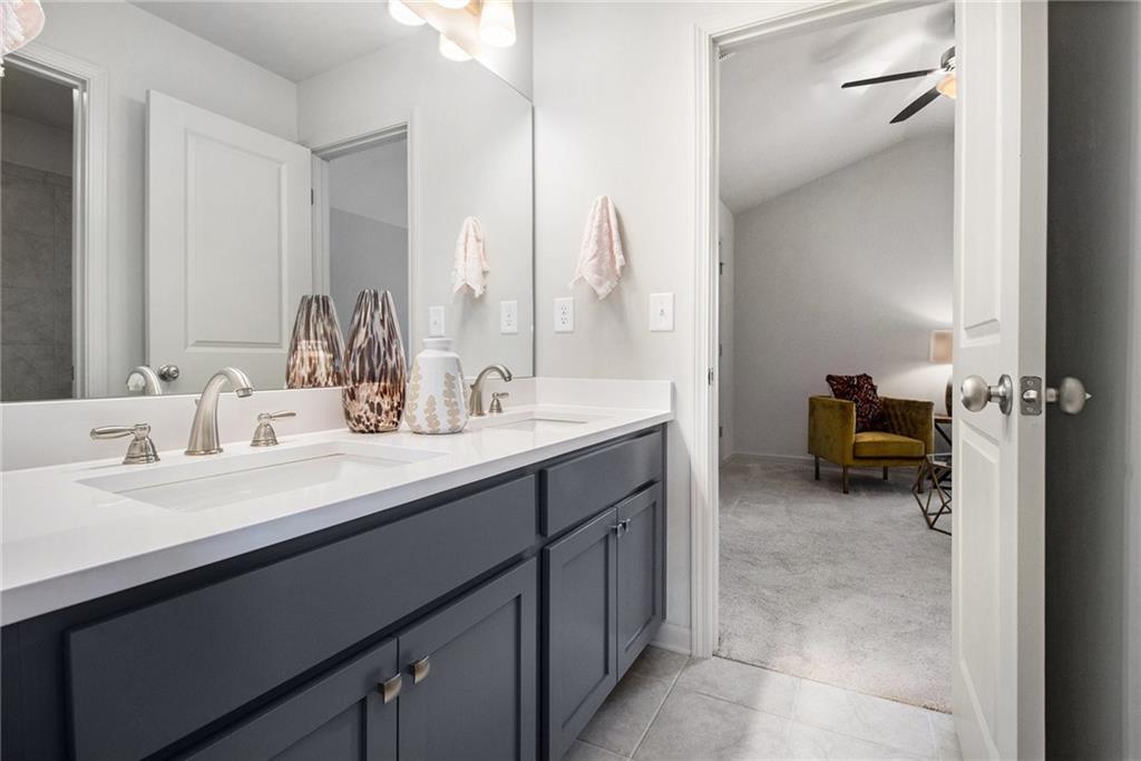 3235 Rockbridge Road Southwest Avondale Estates, GA 30002 - Photo 27 of 37 a en suite bathroom with a double vanity sink and a mirror