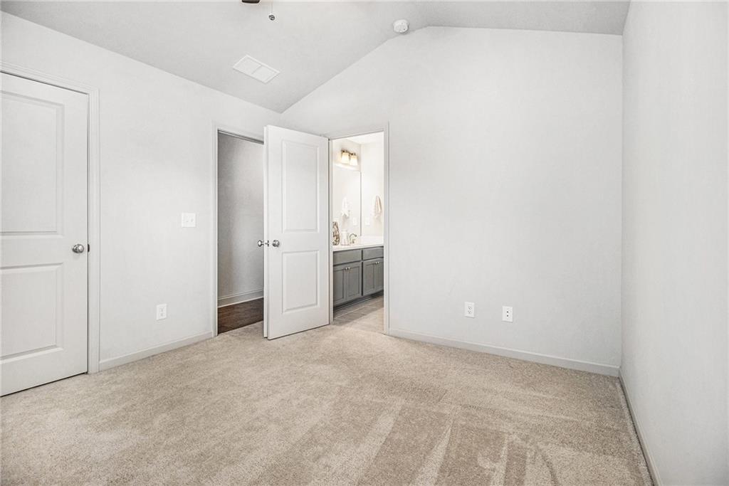 3235 Rockbridge Road Southwest Avondale Estates, GA 30002 - Photo 30 of 37 an empty room with closet and windows