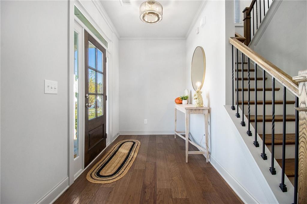 3235 Rockbridge Road Southwest Avondale Estates, GA 30002 - Photo 3 of 37 a view of hallway with wooden floor and stairs