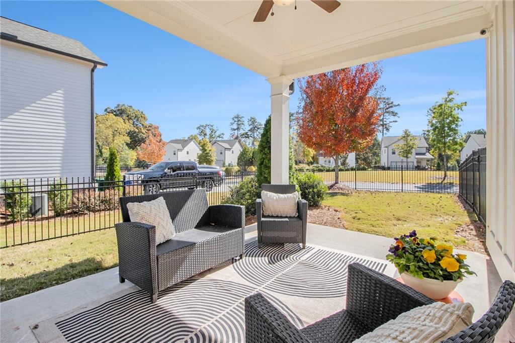 3235 Rockbridge Road Southwest Avondale Estates, GA 30002 - Photo 31 of 37 a view of a balcony with furniture and a potted plant