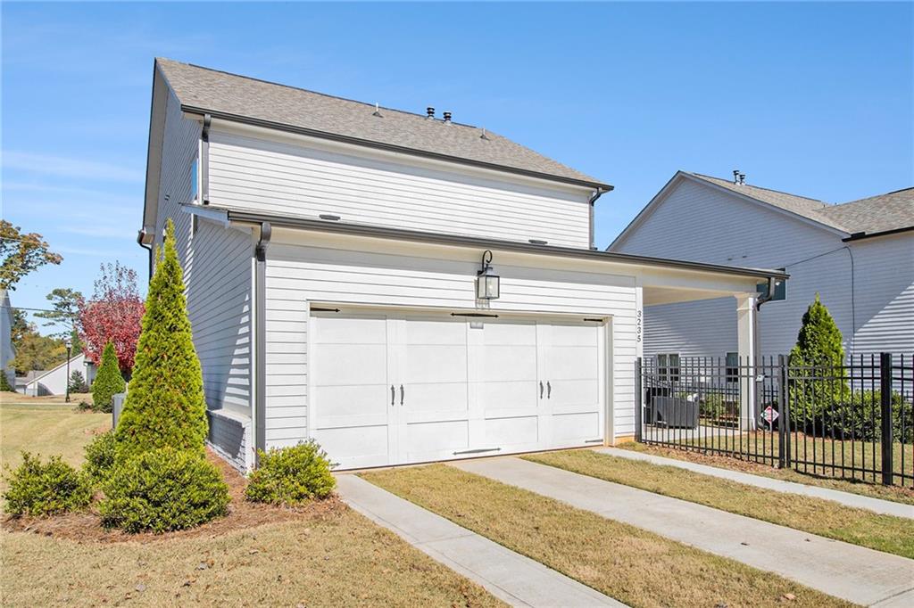 3235 Rockbridge Road Southwest Avondale Estates, GA 30002 - Photo 33 of 37 a front view of a house with a garage