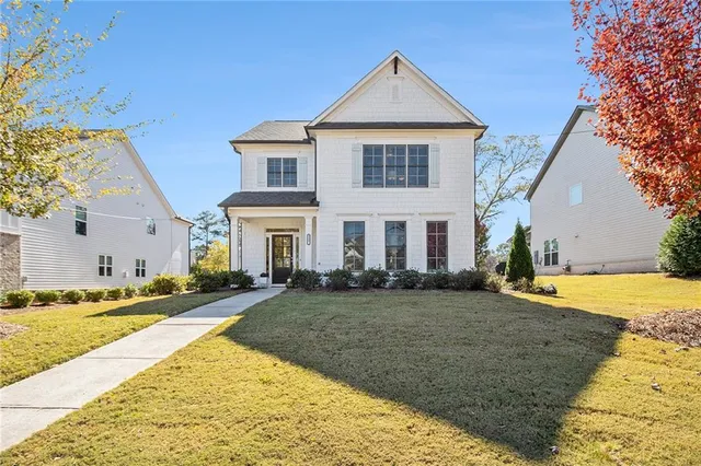 a front view of a house with a yard