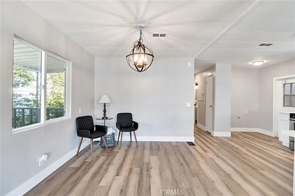 1218 East Cleveland Avenue, Unit 153 Madera, CA 93638 - Photo 14 of 39 a view of livingroom with furniture wooden floor and windows