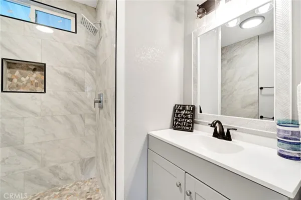 a bathroom with a sink and a mirror