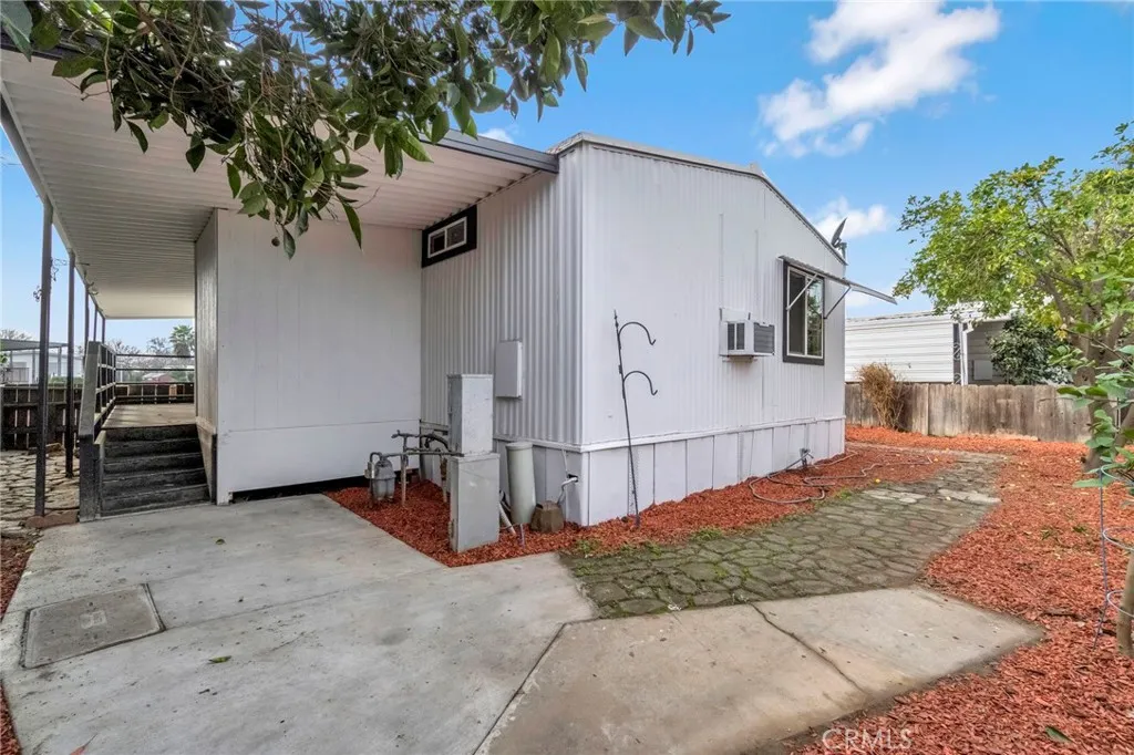 1218 East Cleveland Avenue, Unit 153 Madera, CA 93638 - Photo 29 of 39 a view of a house with a backyard